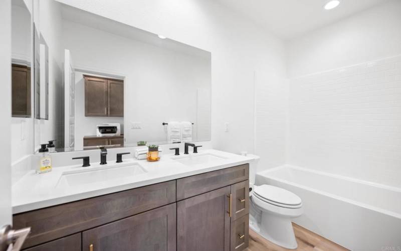 Second Bathroom with shower tub and upgraded features such as squared double sinks!