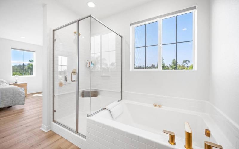 Primary Bathroom with Soaking Tub and separate Shower enclosure.   Double upgraded sinks and counter