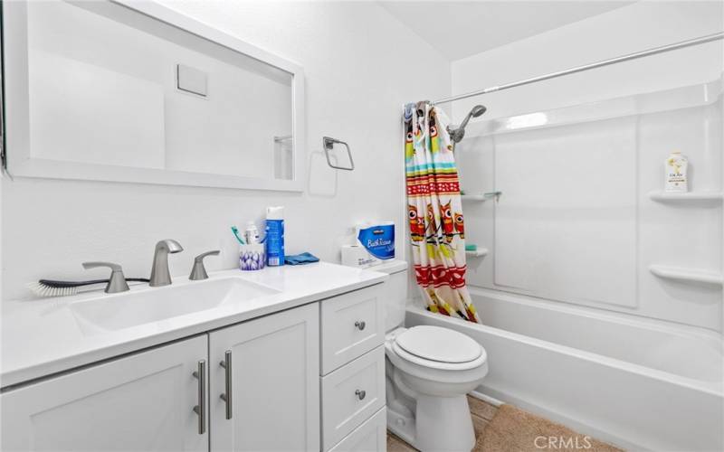 Guest bathroom with under sink cabinets