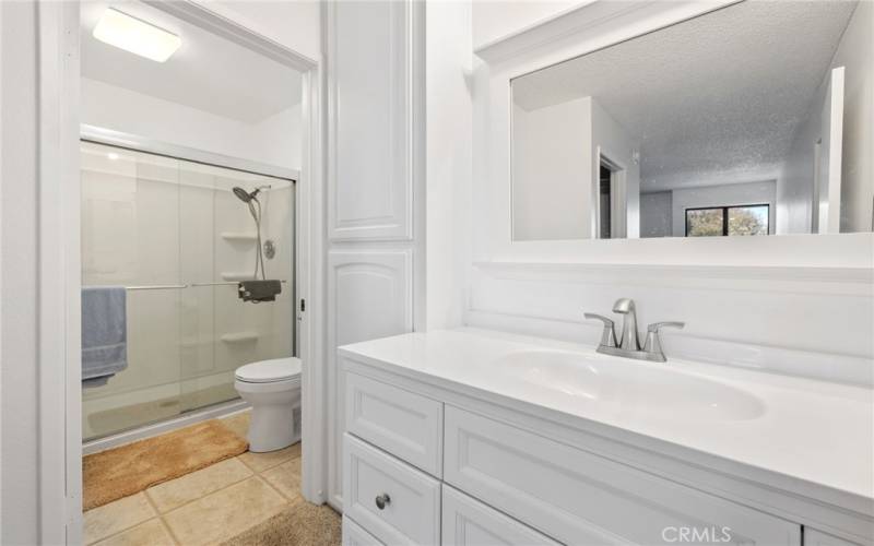 Bathroom with built in wall cabinets and under sink storage