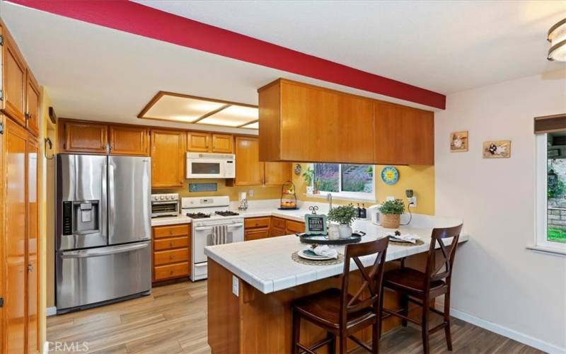 Kitchen with breakfast bar and is open to the family room