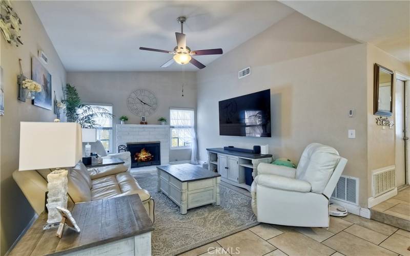Enjoy relaxing in the inviting living room with the entry to the right