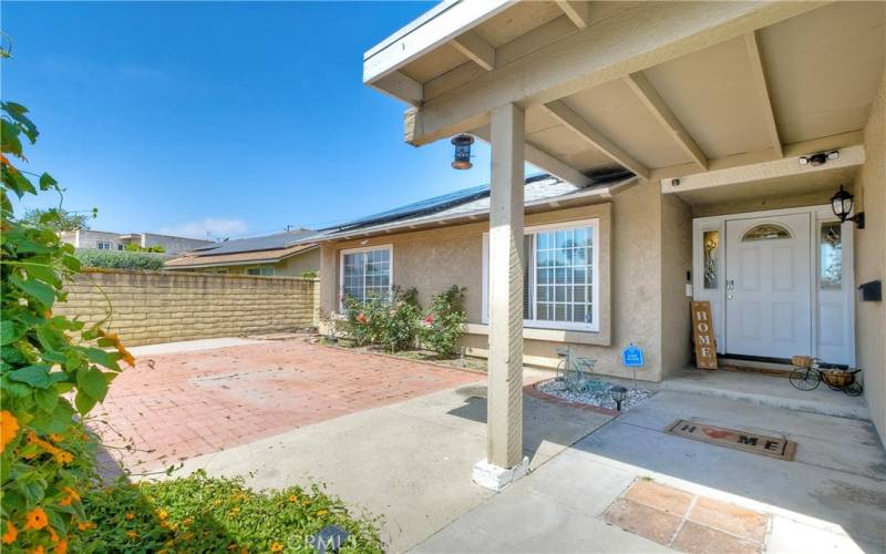 Inviting gated entry, yard wraps around to rear yard