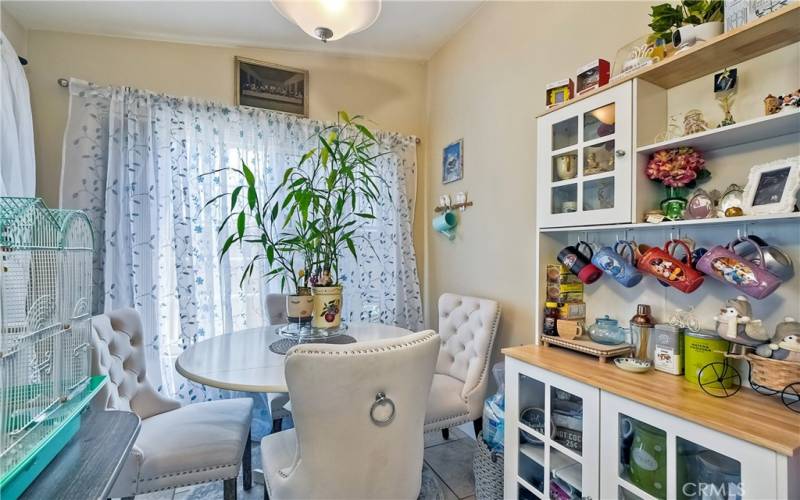 Kitchenette, dining area off kitchen, offers sliding doors to rear yard