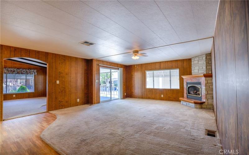  The family room has a large sliding glass door that leads out to the covered front porch.