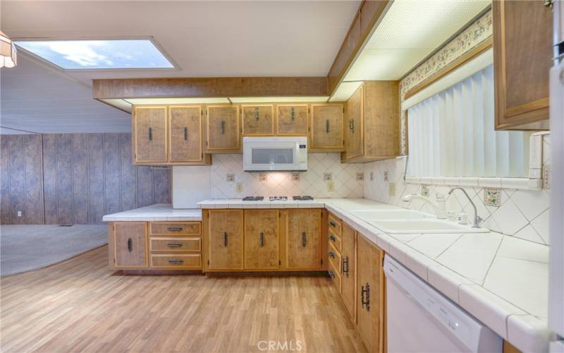 The kitchen connects to the dining area and has laminate wood floors, great for quick clean up.