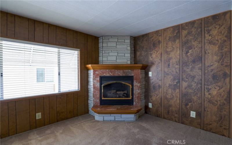 Anchoring the corner of the family room is a delightful gas fireplace.