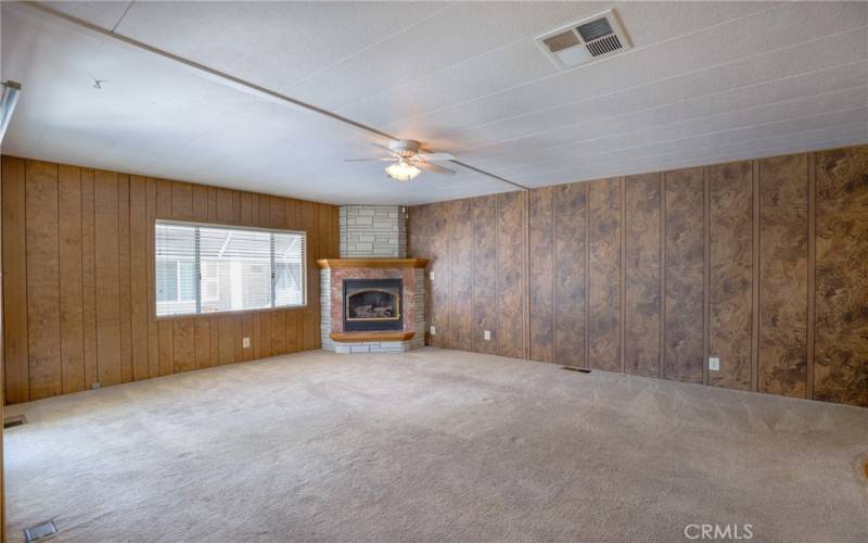 The large family room is right off the kitchen and provides a comfortable space to relax.