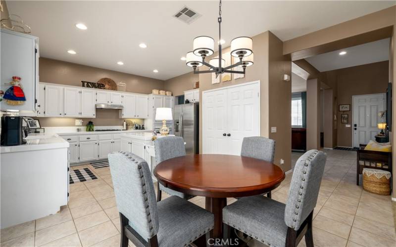 View of eating area and kitchen.