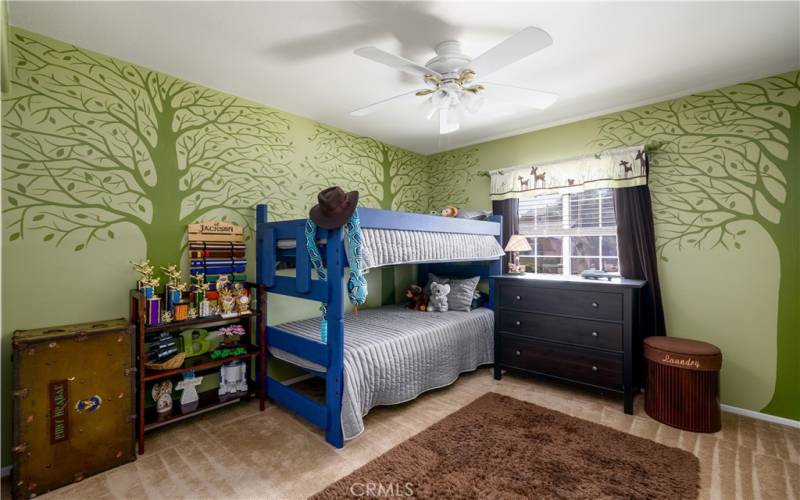 Fourth upstairs secondary bedroom with ceiling fan.