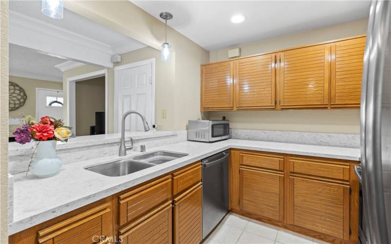 Gorgeous Quartz countertops, with handsome cupboards and drawers.