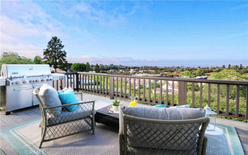 View deck off living room to enjoy the beautiful panoramic views! BBQ grill is included in the sale