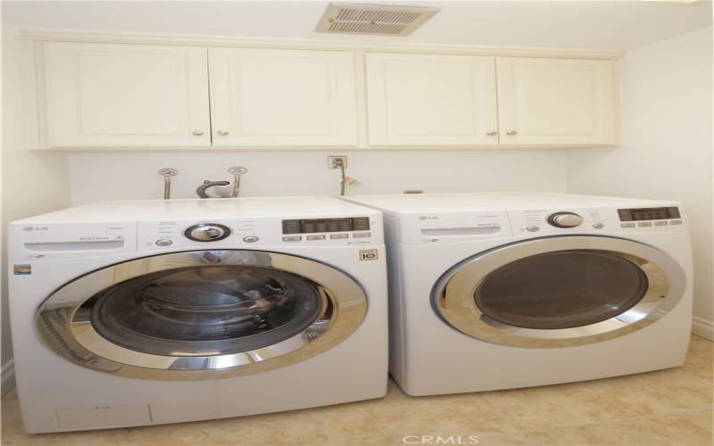 Laundry room with washer and dryer included in the sale