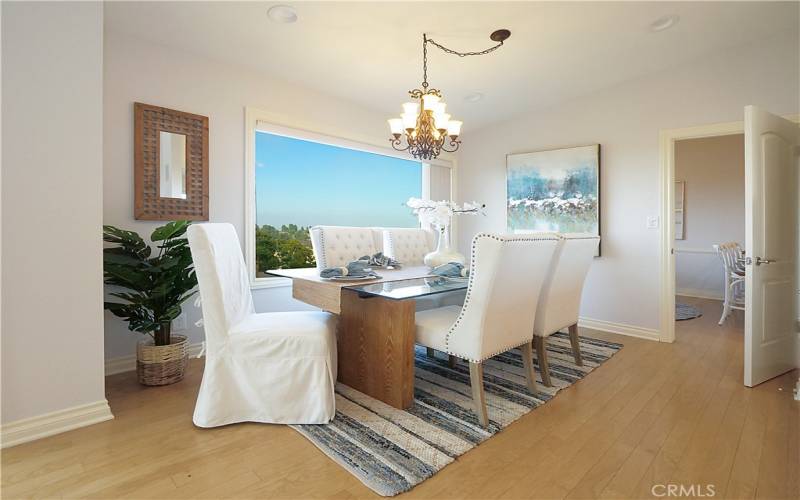Formal dining area off living room with vaulted ceiling and gorgeous views