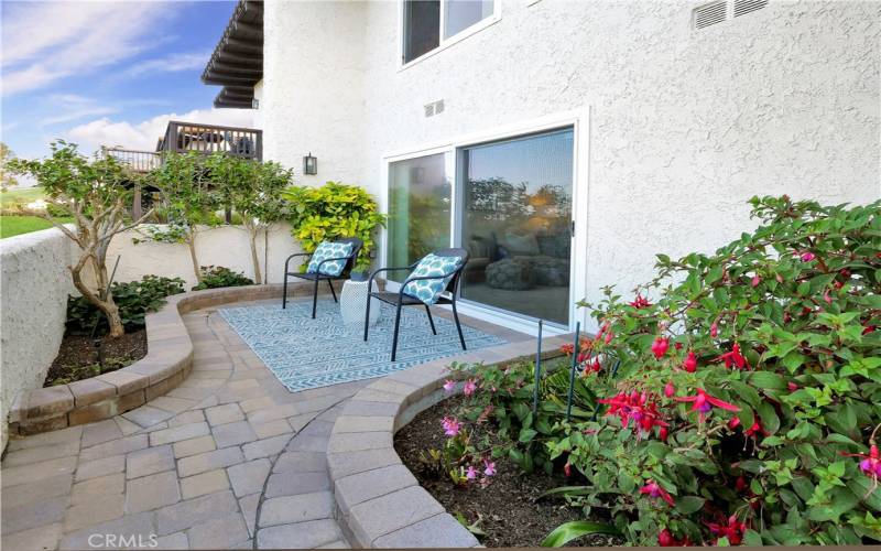 Beautifully landscaped private patio with pavers
