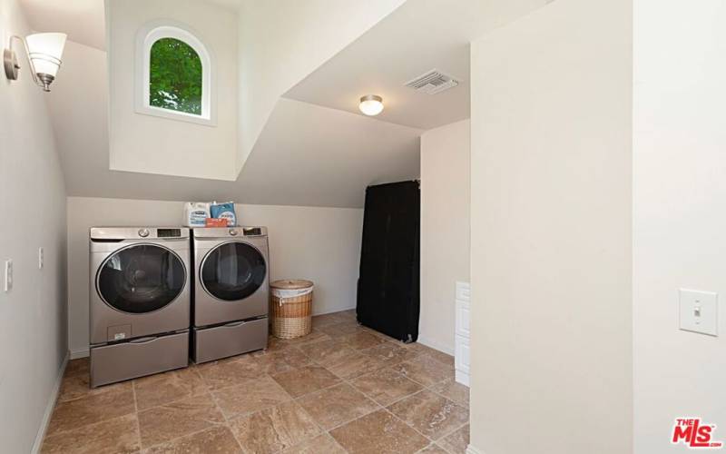 2nd level laundry room that could house home gym equipment or hold extra storage