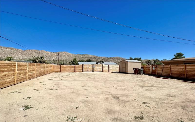 Huge backyard used as parking lot.