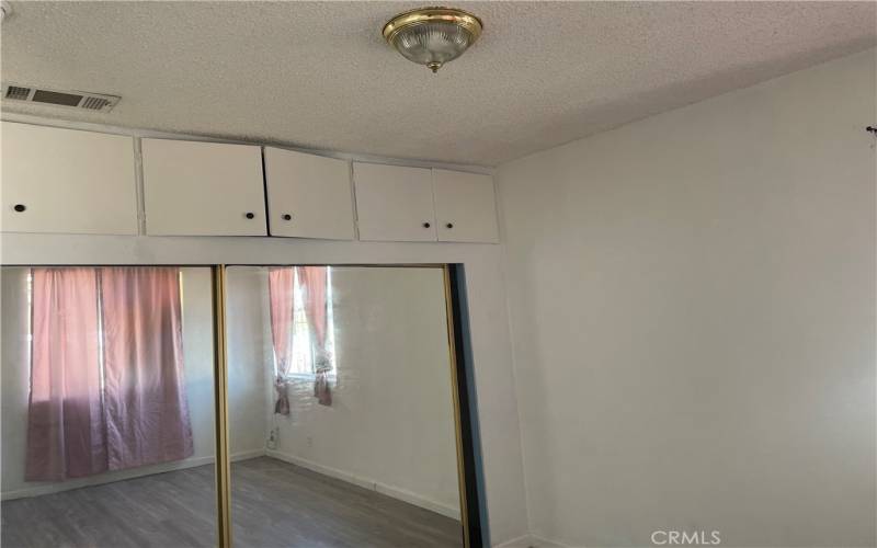 1st Bedroom, large mirror closet and top storage