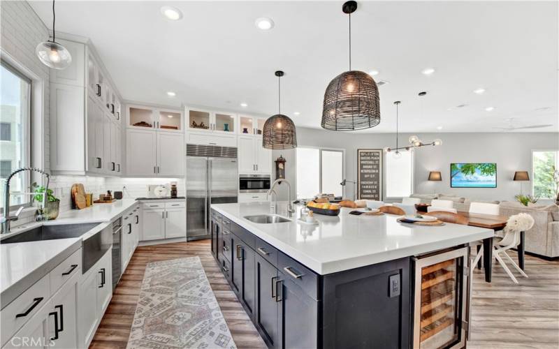 Upgraded kitchen features Sub-Zero refrigerator, Wolf stainless steel appliances and wine fridge