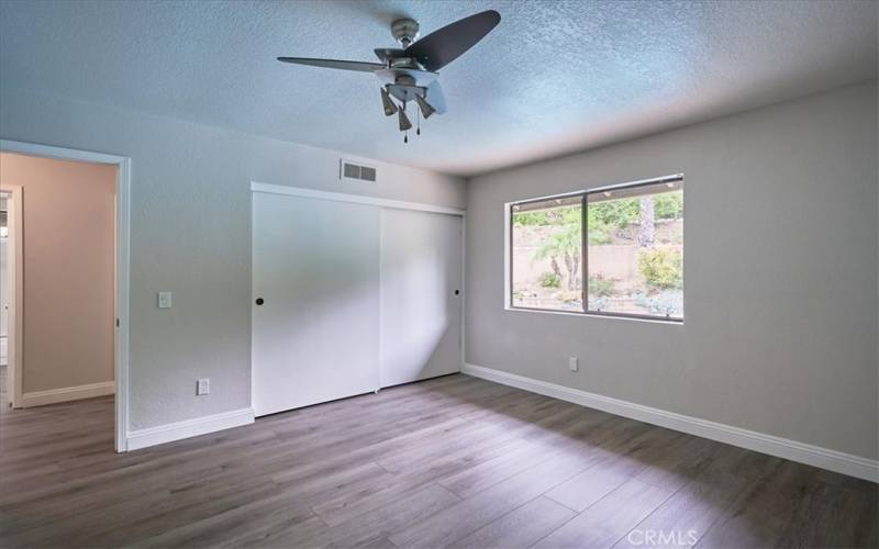 Another large bedroom across from 2nd guest bath with a backyard view!