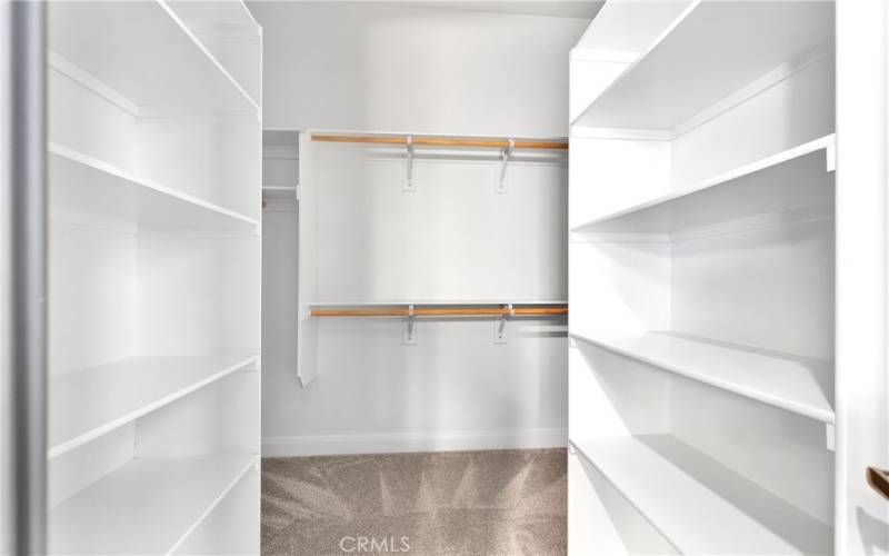 Large primary closet with built-ins.