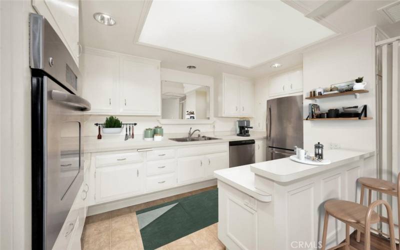 Natural light filters into this kitchen through a large skylight.  Virtual staging
