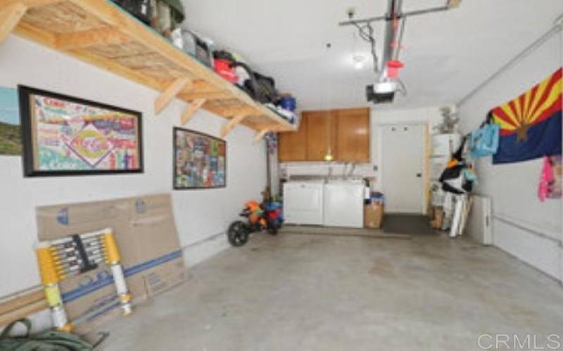 1-Car Garage with shelving and Washer/Dryer