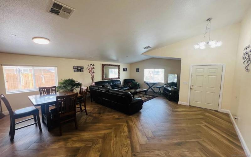 Large Family room/Dinning room combo with vaulted ceilings