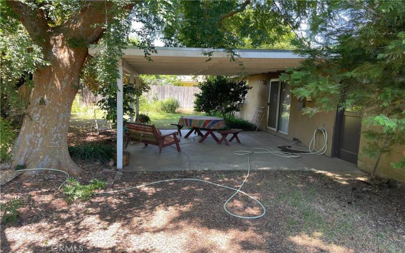 Side view of covered patio in back yard