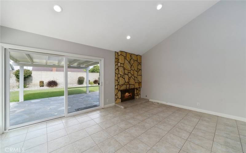 The large separate family room offers dual pane vinyl-framed sliding glass doors with garden views.