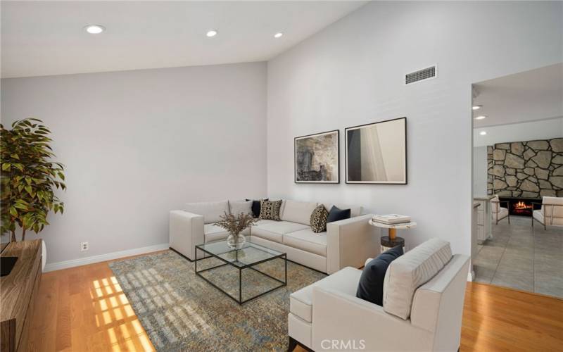 Enter through the upgraded double door entry into the light and bright formal area with vaulted ceilings. The generous formal living room offers fresh new paint and recessed lighting. (Virtual staging)