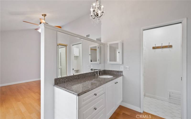 The primary ensuite bath is highlighted with newer cabinetry and attractive granite countertops.