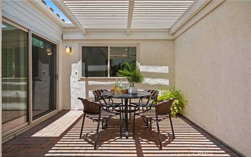 Front courtyard patio is perfect for outdoor living and entertaining