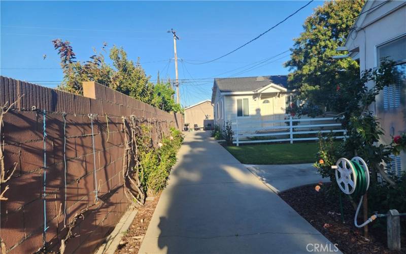 Long drive towards the second unit in the back, in addition to the circular driveway