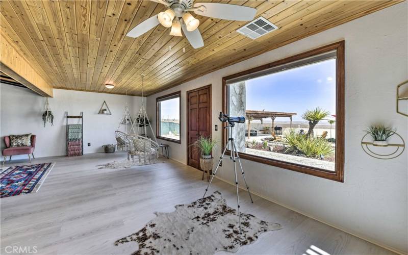 The sunroom windows provide picture-perfect views of the desert.