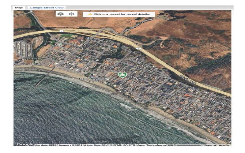 Green icon identifies the lot in this satellite image.  Close proximity to beach and pier.