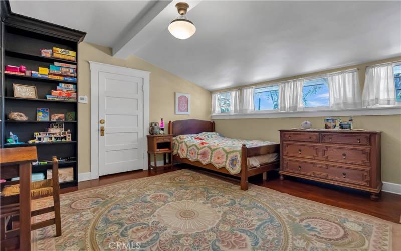 Upper from facing bedroom is quaint with clerestory windows and three enormous closets.