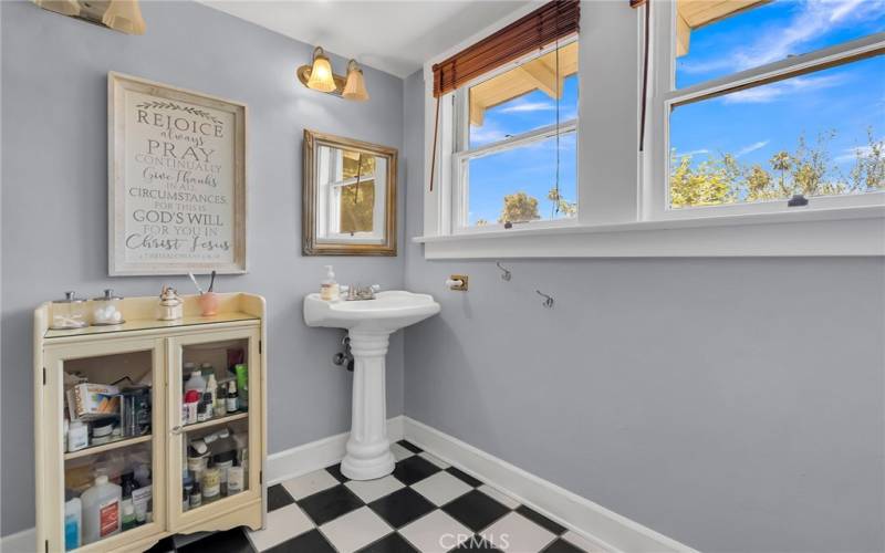 Upstairs bathroom has a shower and extra large closet space.