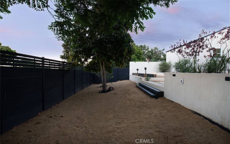 Additional space in backyard with custom fence