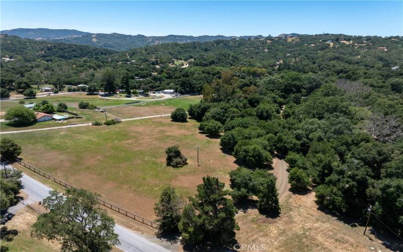 There is a separate piece of land with its own APN, ~ 2.58 acres, also available for purchase. You could build a home, workshop or keep it for a buffer from the road.