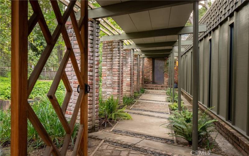 Extraordinary covered walkway leads you to the front door.