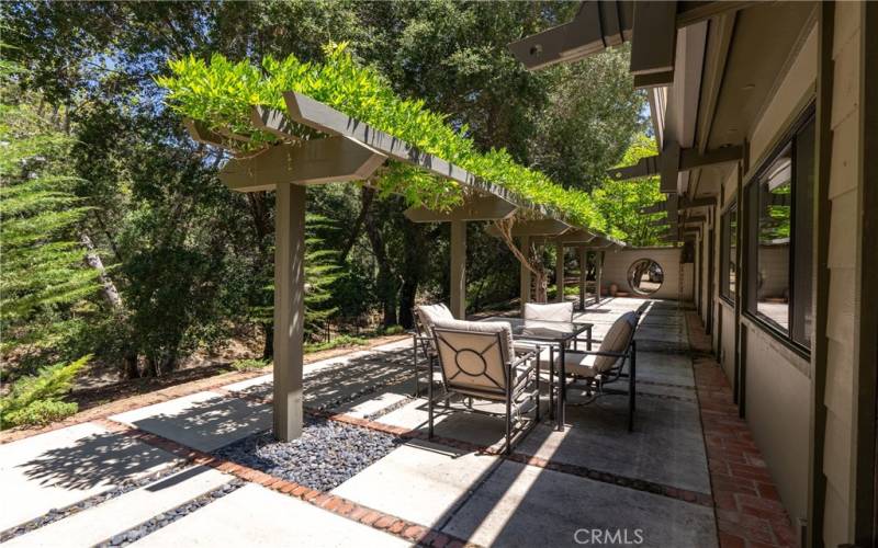 The expansive back patio offers a stylish spot to relax or entertain.