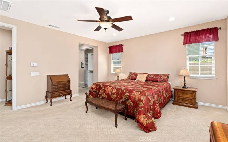 Spacious Master Bedroom with lighted ceiling fan