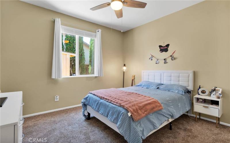 Bedroom 2 has new paint and carpet, and is upgraded with a lighted ceiling fan.