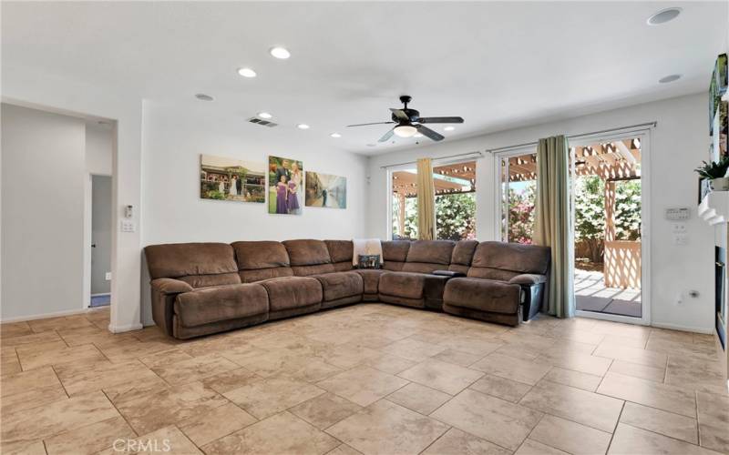 Large family room with fireplace and media niche.