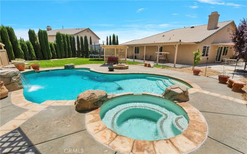 Custom designed pool with rock features and waterfall.