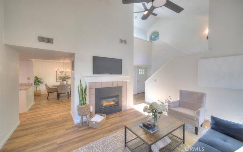The living room has a gas fireplace and cathedral ceilings.