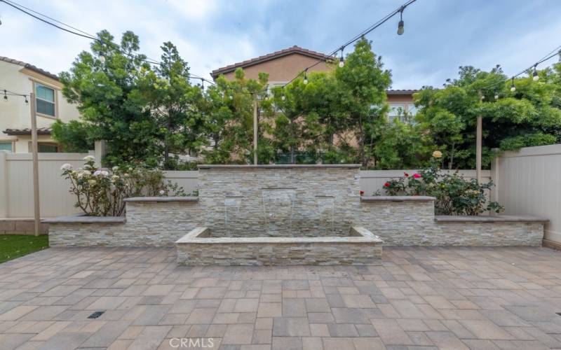 Backyard boasts this beautiful & impressive water feature, operated by remote control
