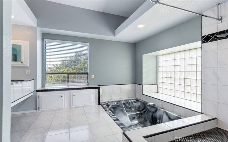 The ensuite bathroom offers a spacious area to unwind.