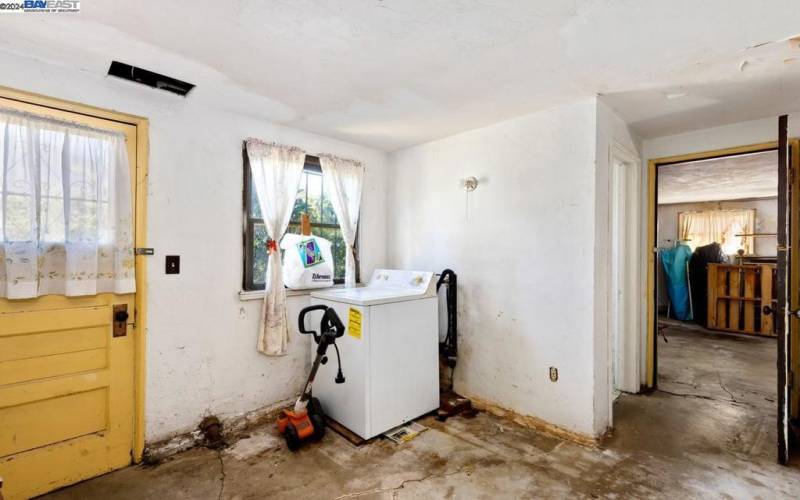 Laundry space, garage access, back yard access.
